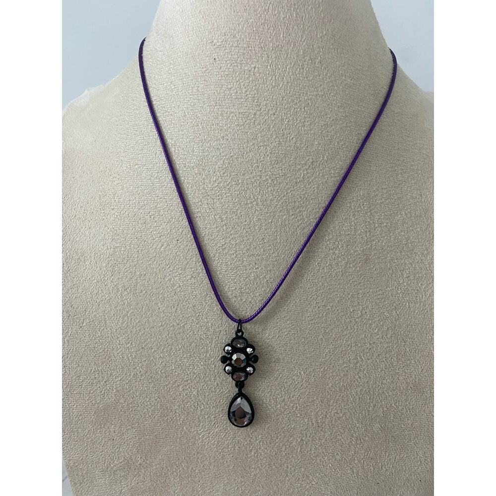 black pendant with gray rhinestone